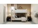 Modern bedroom with a stylish bunk bed, neutral decor, and decorative mountain shelves at 18137 Serene Lake Loop, Lutz, FL 33548