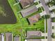 Aerial view of the backyard, showcasing the pond and well-maintained landscaping at 1821 Hawks View Dr, Ruskin, FL 33570