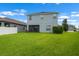 Spacious backyard with lush green lawn at 1821 Hawks View Dr, Ruskin, FL 33570