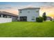 Spacious backyard with lush green lawn and privacy fence at 1821 Hawks View Dr, Ruskin, FL 33570