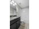 Modern bathroom features granite countertops and a shower-tub combo at 1821 Hawks View Dr, Ruskin, FL 33570