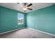 Bedroom boasts natural light and a ceiling fan at 1821 Hawks View Dr, Ruskin, FL 33570