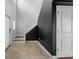 Bright entryway featuring a tiled floor, coat closet, stairs leading upstairs, and natural light at 1821 Hawks View Dr, Ruskin, FL 33570
