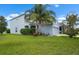 Beautiful two-story home with mature landscaping and a well-maintained lawn creating an inviting curb appeal at 1821 Hawks View Dr, Ruskin, FL 33570