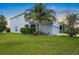Beautiful two-story home featuring mature landscaping and a well-manicured lawn in a great neighborhood at 1821 Hawks View Dr, Ruskin, FL 33570