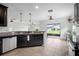 Open concept kitchen with stainless steel appliances and access to outdoor patio at 1821 Hawks View Dr, Ruskin, FL 33570