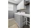 Functional laundry room with washer, dryer, and storage cabinets at 1821 Hawks View Dr, Ruskin, FL 33570