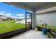 Screened patio with views of the backyard and canal at 1821 Hawks View Dr, Ruskin, FL 33570