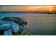 Breathtaking sunset aerial view of waterfront homes and city skyline from the water at 2 Seaside Ln # 203, Belleair, FL 33756