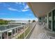 Spacious tiled balcony with views of the boat docks and sparkling waters, perfect for relaxing or entertaining guests at 2 Seaside Ln # 203, Belleair, FL 33756