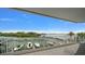 Stunning balcony view overlooking the marina with boat docks and lush tropical scenery at 2 Seaside Ln # 203, Belleair, FL 33756