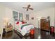 Bedroom with a ceiling fan, wooden flooring, and plenty of natural light at 2 Seaside Ln # 203, Belleair, FL 33756