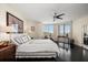 Bright bedroom with dark wood floors, neutral walls, and view of the water at 2 Seaside Ln # 203, Belleair, FL 33756