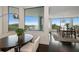 Bright dining area with water views and elegant lighting at 2 Seaside Ln # 203, Belleair, FL 33756