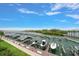 Scenic view of a marina with multiple boat slips on a clear day with blue skies at 2 Seaside Ln # 203, Belleair, FL 33756