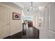 Inviting entryway with dark hardwood floors leading to the living area at 2 Seaside Ln # 203, Belleair, FL 33756