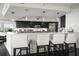 Modern kitchen with white counters, bar seating, and stainless steel appliances at 2 Seaside Ln # 203, Belleair, FL 33756