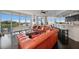 Inviting living room with expansive windows offering stunning waterfront views and plenty of natural light at 2 Seaside Ln # 203, Belleair, FL 33756