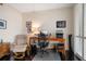 Home office features a wooden desk, a leather chair, and plenty of natural light at 2 Seaside Ln # 203, Belleair, FL 33756