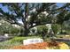Beautifully landscaped Sea Side Villas signage, creating a welcoming entrance to the community at 2 Seaside Ln # 203, Belleair, FL 33756