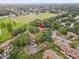 Overhead angle displays the property nestled among trees with nearby baseball fields, creating a scenic and convenient locale at 2078 Sunset Point Rd # 83, Clearwater, FL 33765