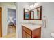 Bathroom features a vanity and a view to the bedroom at 2078 Sunset Point Rd # 83, Clearwater, FL 33765