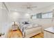 Cozy bedroom featuring a comfortable bed, window, and closet at 2078 Sunset Point Rd # 83, Clearwater, FL 33765