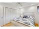 Comfortable bedroom with closet, bed, and nice finishes at 2078 Sunset Point Rd # 83, Clearwater, FL 33765