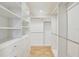 Spacious walk-in closet with shelving and racks at 2078 Sunset Point Rd # 83, Clearwater, FL 33765