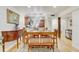 Dining room showcasing hardwood floors, wood furniture, and ample natural light at 2078 Sunset Point Rd # 83, Clearwater, FL 33765