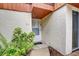 Inviting entryway with white door, neutral paint, and tile landing at 2078 Sunset Point Rd # 83, Clearwater, FL 33765