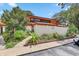 Charming two-story townhouse featuring well-kept landscaping, a walkway, and a private fence at 2078 Sunset Point Rd # 83, Clearwater, FL 33765