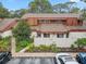 Aerial view showcasing the property's location, landscaping, and proximity to parking at 2078 Sunset Point Rd # 83, Clearwater, FL 33765