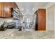 Modern kitchen with stainless steel appliances and breakfast table near the window at 2078 Sunset Point Rd # 83, Clearwater, FL 33765