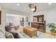 Comfortable living room featuring wood floors, modern ceiling fan, and stylish furnishings at 2078 Sunset Point Rd # 83, Clearwater, FL 33765