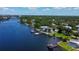 Stunning aerial perspective of waterfront homes with boat docks, lush landscaping and waterway access at 2205 N Riverside Dr, Tampa, FL 33602