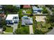 Aerial shot featuring a home with a private pool, situated among well-kept lawns and mature trees at 2205 N Riverside Dr, Tampa, FL 33602