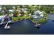Aerial view of a waterfront property on a sunny day, with dock access at 2205 N Riverside Dr, Tampa, FL 33602