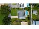 Aerial perspective of a home with a private pool, showcasing its well-maintained lawn and suburban setting at 2205 N Riverside Dr, Tampa, FL 33602