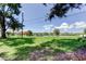 A grassy backyard on the water, offering a serene view and potential for outdoor enjoyment at 2205 N Riverside Dr, Tampa, FL 33602