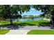 Street view of a waterfront lot featuring green grass and mature trees with views of the river at 2205 N Riverside Dr, Tampa, FL 33602