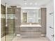 Modern bathroom featuring a glass shower, double sink vanity and tiled walls at 2205 N Riverside Dr, Tampa, FL 33602