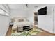 Bright bedroom with leafy rug, and tv, with an en suite bathroom at 2205 N Riverside Dr, Tampa, FL 33602