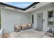 Covered entryway with seating, offering a cozy welcome to this home at 2205 N Riverside Dr, Tampa, FL 33602