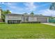 Ranch home with lush lawn and manicured bushes in front at 2205 N Riverside Dr, Tampa, FL 33602