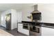Modern kitchen with stainless steel appliances, sleek cabinetry, and updated fixtures at 2205 N Riverside Dr, Tampa, FL 33602