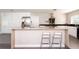 Spacious kitchen island with seating, stainless steel appliances, and modern fixtures at 2205 N Riverside Dr, Tampa, FL 33602