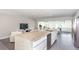 Modern kitchen with a large island, seating, and stainless steel appliances at 2205 N Riverside Dr, Tampa, FL 33602