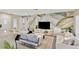 Inviting living room featuring modern decor, stylish furnishings, and a large decorative wall design at 2205 N Riverside Dr, Tampa, FL 33602