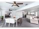 View of a modern dining room and living room with neutral colors and decor, and an open floor plan at 2205 N Riverside Dr, Tampa, FL 33602